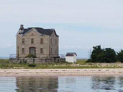 Cedar Point Lighthouse overlooking Gardiners Bat in East Hampton, NY