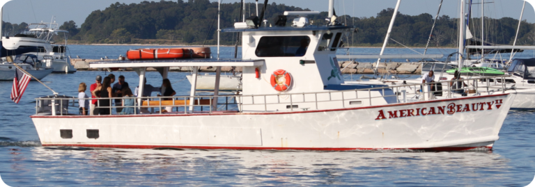 The boat American Beauty II starting a small private charter in Sag Harbor Bay.