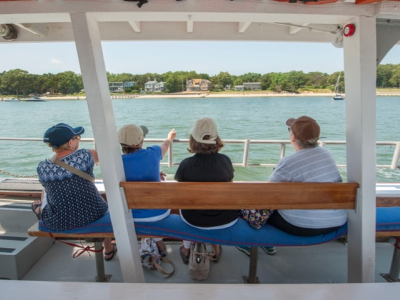 3 people enjoying a nature cruise boat ride aboard American Beauty II in Sag Harbor Bay