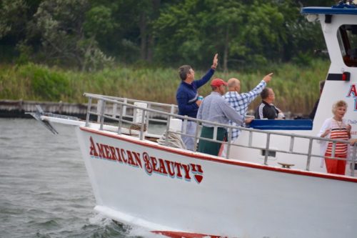 Guests on American Beauty II spotting something interesting during a 90 minute nature cruise near Mashomack Nature Preserve.