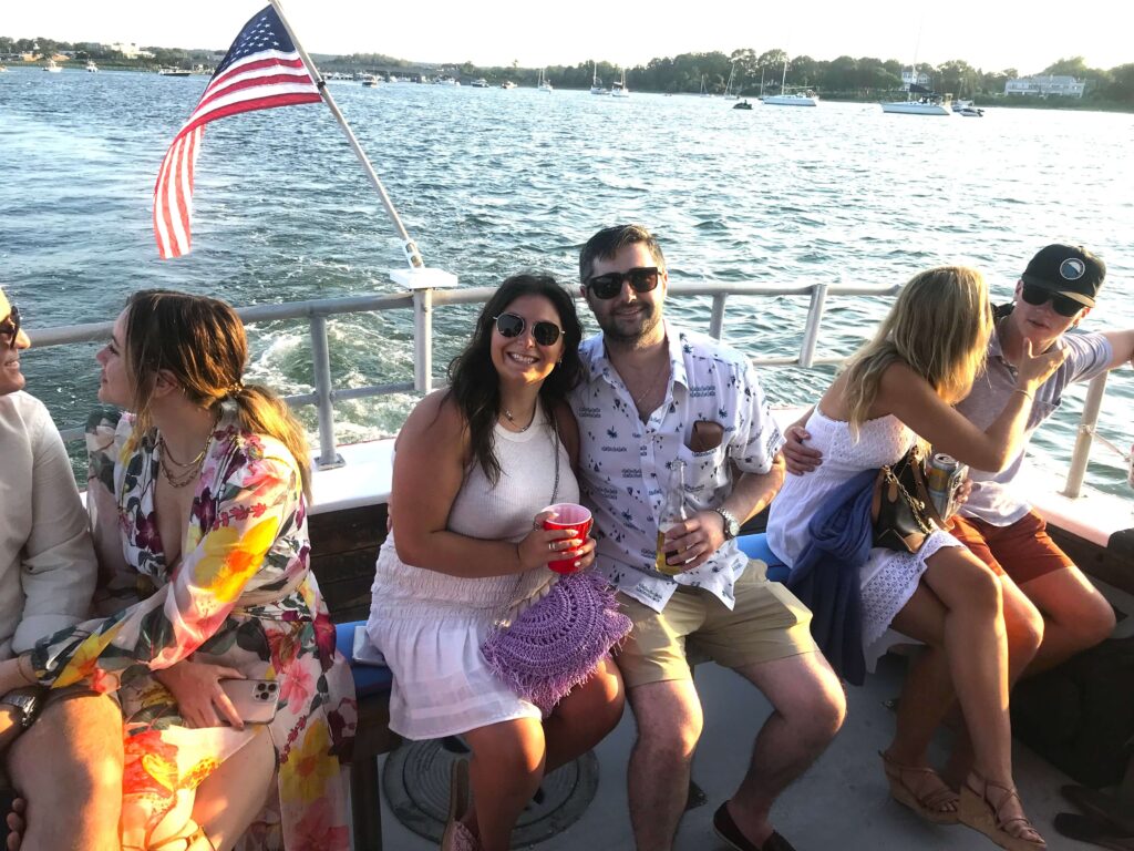Couples enjoying a sunset aboard American Beauty II in Sag Harbor