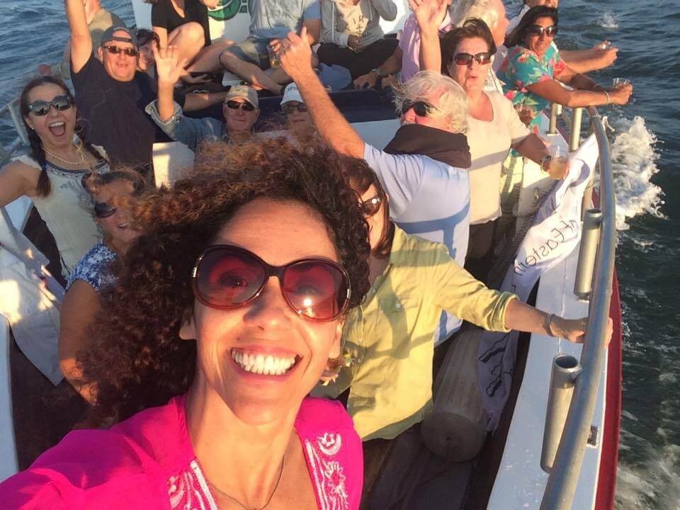 Guests enjoying a sunset aboard American Beauty II in Sag Harbor